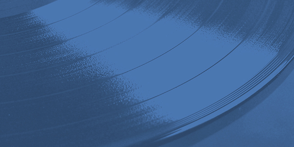 a close up of a vinyl record on a blue background